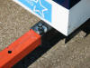 Outriggers lock in extended position, detering theft